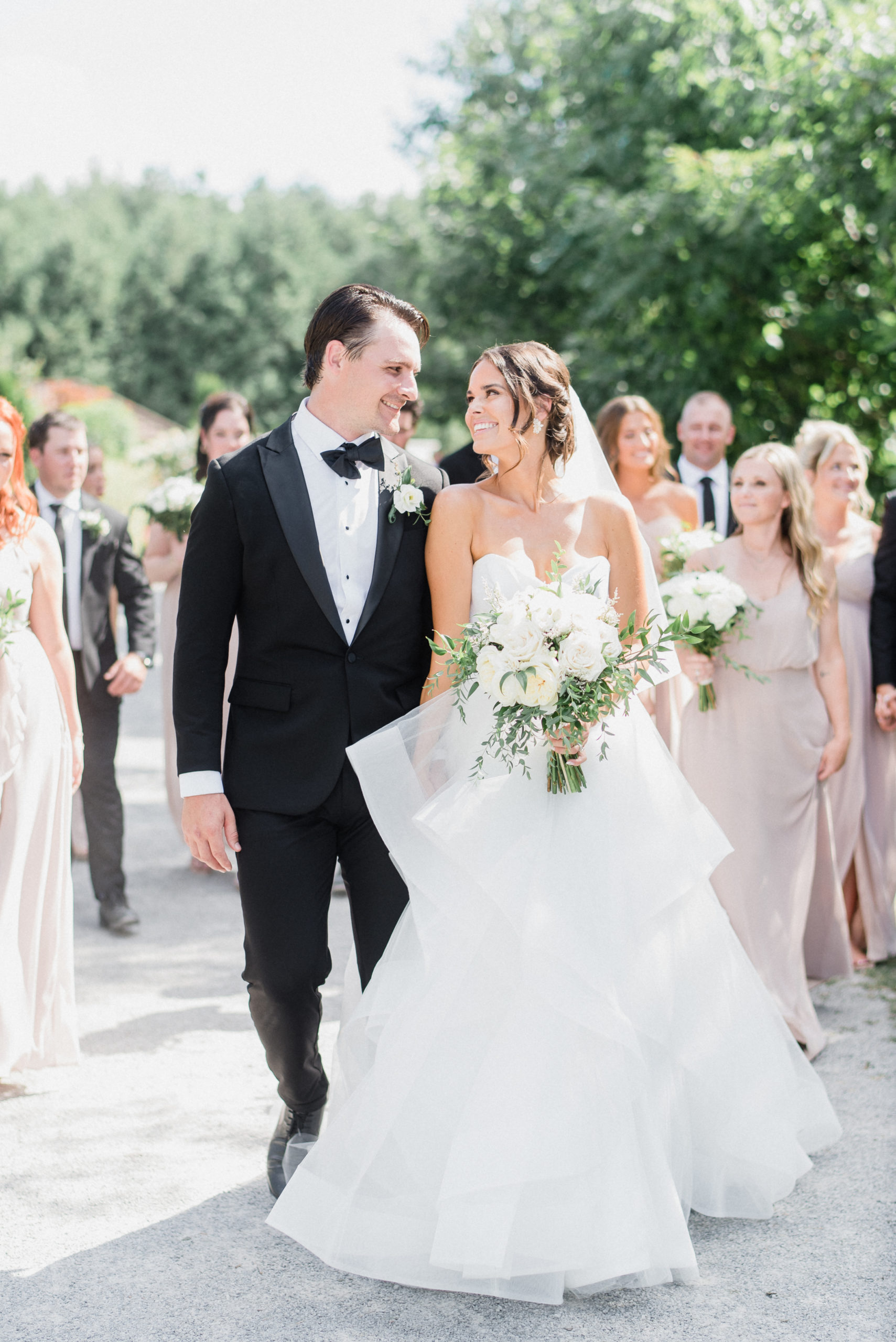 Wedding party walking as a group at Kurtz Orchard, Niagara-on-the-Lake by NHL wedding photographer Jenn Kavanagh Photography